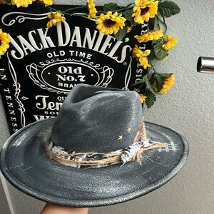 Hat with stars feather and ribbon